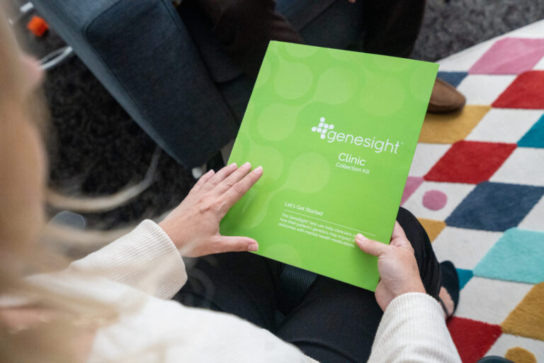 Person holding green folder